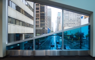 tinted office window looking onto street