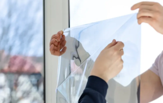 Experts applying window films.